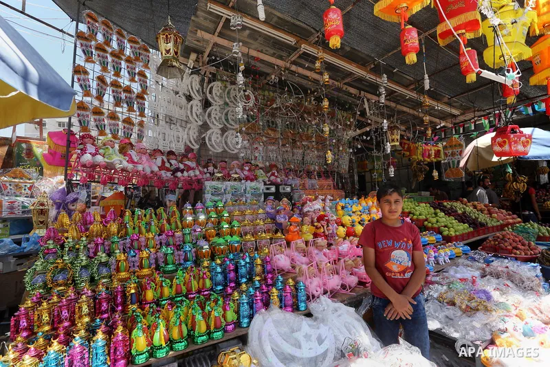 A Palestinian vendor displays a traditional lantern known in Arabic as "Fanous" in a market in Gaza city as the faithful prepare for the start of the Muslim holy fasting month of Ramadan on May 31, 2016. More than 1.5 bi...