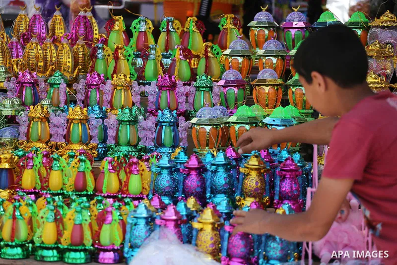 A Palestinian vendor displays a traditional lantern known in Arabic as "Fanous" in a market in Gaza city as the faithful prepare for the start of the Muslim holy fasting month of Ramadan on May 31, 2016. More than 1.5 bi...
