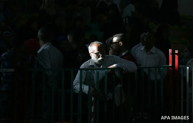 Palestinians wait for travel permits to cross into Egypt through the Rafah border crossing after it was opened for four days by Egyptian authorities, in the southern Gaza Strip June 1, 2016. Photo by Abed Rahim Khatib