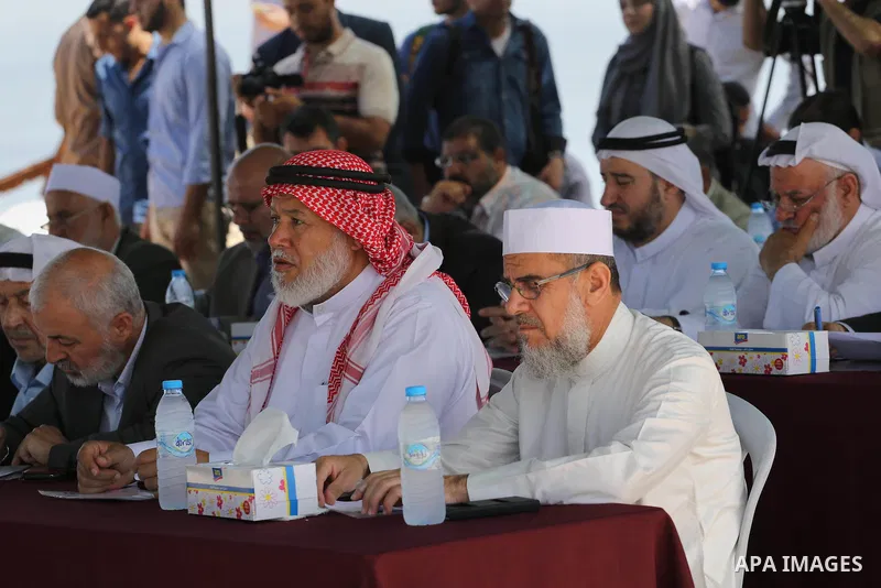 Members of the Palestinian legislative council from Hamas movement attend a meeting at the legislative council, at seaport of Gaza city, on 01 June 2016. Photo by Mohammed Asad