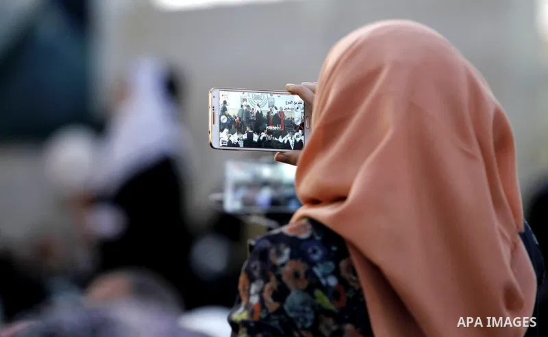 Palestinian students attend their graduation ceremony at the end of the academic year on June 01, 2016 at Hebron University in the West Bank city of Hebron. Photo by Wisam Hashlamoun