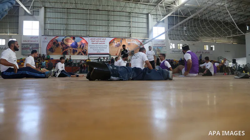 Disabled Palestinians take part in the closing ceremony of the wheelchairs basketball training camp organised by the International Committee of the Red Cross (ICRC) , in Gaza city on june 2, 2016. Photo by Nidal Alwaheid...