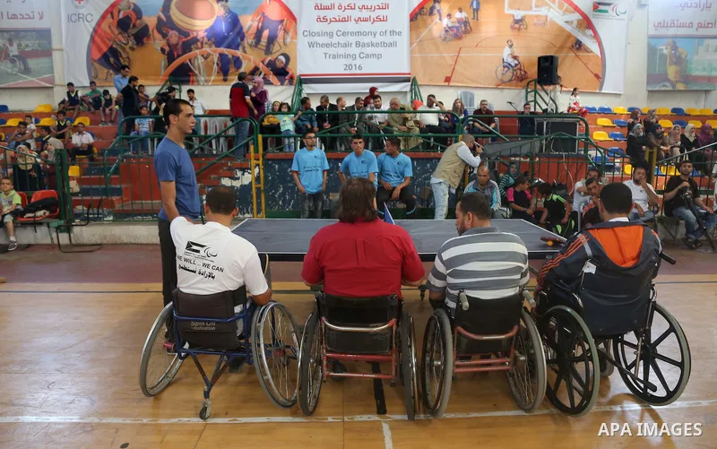 Disabled Palestinians take part in the closing ceremony of the wheelchairs basketball training camp organised by the International Committee of the Red Cross (ICRC) , in Gaza city on june 2, 2016. Photo by Nidal Alwaheid...