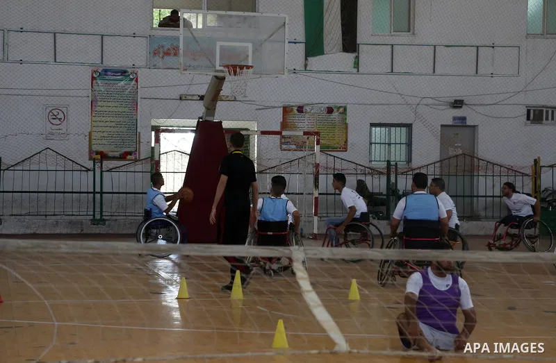 Disabled Palestinians take part in the closing ceremony of the wheelchairs basketball training camp organised by the International Committee of the Red Cross (ICRC) , in Gaza city on june 2, 2016. Photo by Nidal Alwaheid...