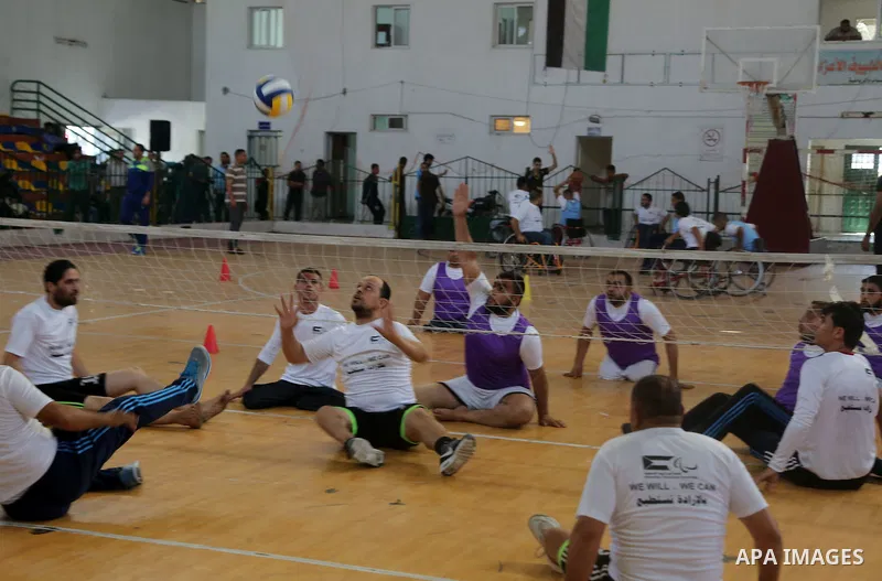 Disabled Palestinians take part in the closing ceremony of the wheelchairs basketball training camp organised by the International Committee of the Red Cross (ICRC) , in Gaza city on june 2, 2016. Photo by Nidal Alwaheid...