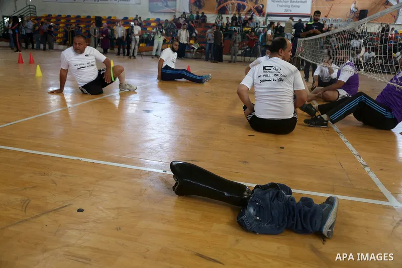 Disabled Palestinians take part in the closing ceremony of the wheelchairs basketball training camp organised by the International Committee of the Red Cross (ICRC) , in Gaza city on june 2, 2016. Photo by Nidal Alwaheid...
