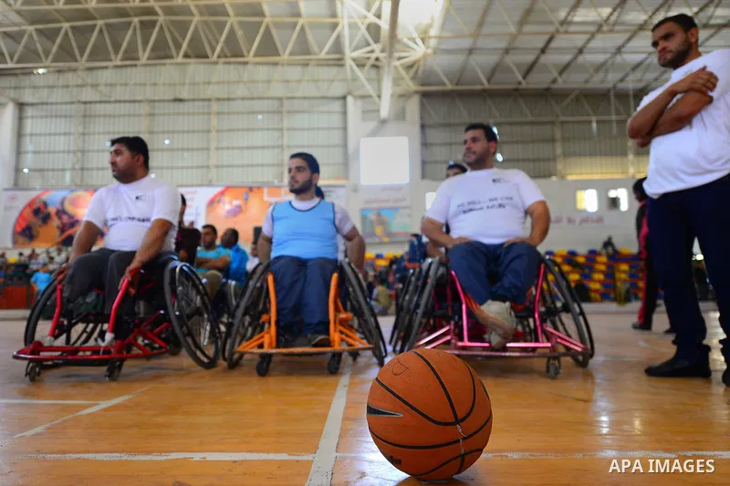 Disabled Palestinians take part in the closing ceremony of the wheelchairs basketball training camp organised by the International Committee of the Red Cross (ICRC) , in Gaza city on june 2, 2016. Photo by Nidal Alwaheid...