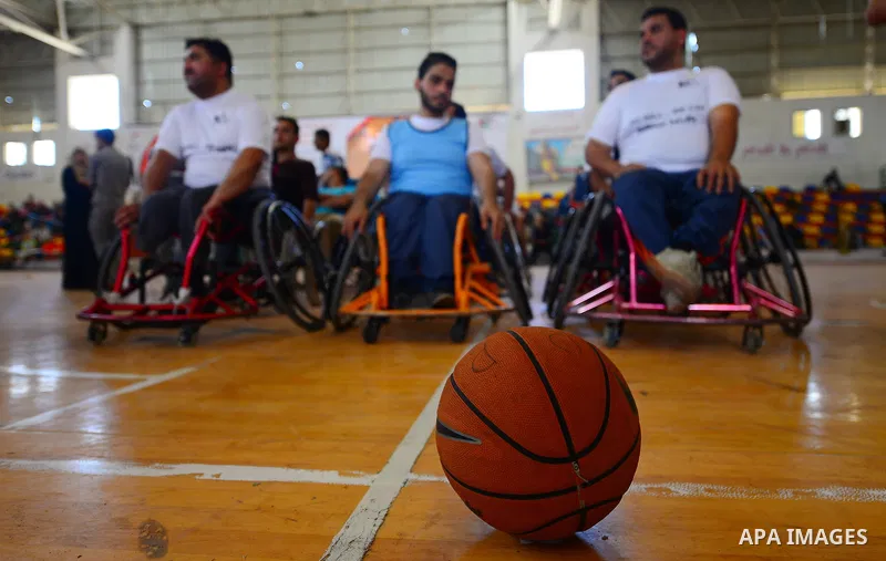 Disabled Palestinians take part in the closing ceremony of the wheelchairs basketball training camp organised by the International Committee of the Red Cross (ICRC) , in Gaza city on june 2, 2016. Photo by Nidal Alwaheid...