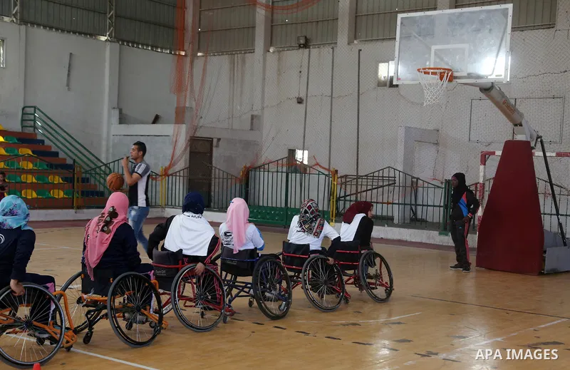 Disabled Palestinians take part in the closing ceremony of the wheelchairs basketball training camp organised by the International Committee of the Red Cross (ICRC) , in Gaza city on june 2, 2016. Photo by Nidal Alwaheid...