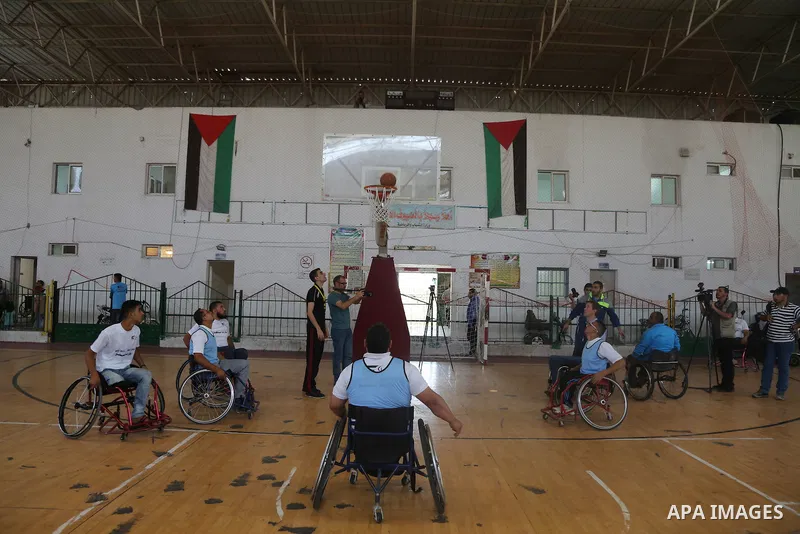 Disabled Palestinians take part in the closing ceremony of the wheelchairs basketball training camp organised by the International Committee of the Red Cross (ICRC) , in Gaza city on june 2, 2016. Photo by Nidal Alwaheid...