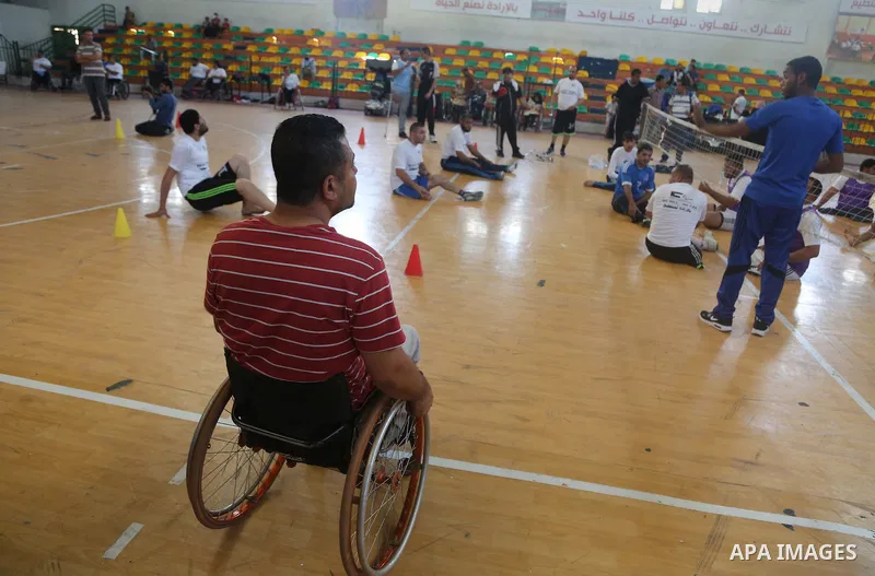 Disabled Palestinians take part in the closing ceremony of the wheelchairs basketball training camp organised by the International Committee of the Red Cross (ICRC) , in Gaza city on june 2, 2016. Photo by Nidal Alwaheid...