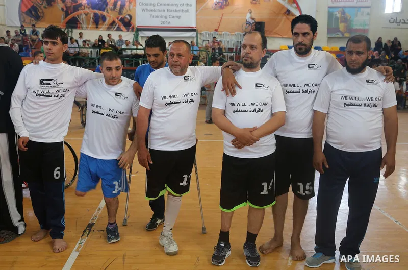Disabled Palestinians take part in the closing ceremony of the wheelchairs basketball training camp organised by the International Committee of the Red Cross (ICRC) , in Gaza city on june 2, 2016. Photo by Nidal Alwaheid...
