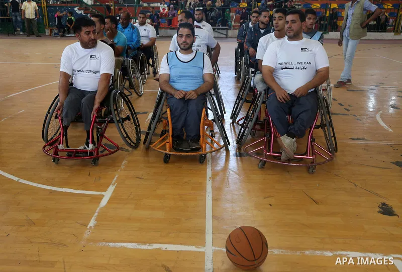 Disabled Palestinians take part in the closing ceremony of the wheelchairs basketball training camp organised by the International Committee of the Red Cross (ICRC) , in Gaza city on june 2, 2016. Photo by Nidal Alwaheid...