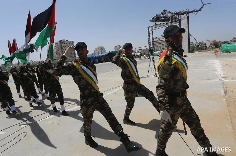 Member of Palestinian security forces display their skills during a military graduation ceremony in Gaza City June 2, 2016. Photo by Mohammed Asad
