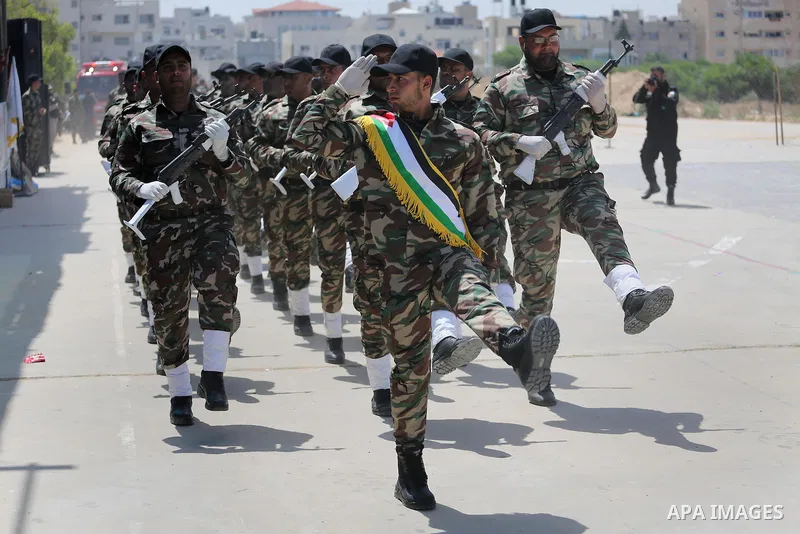 Member of Palestinian security forces display their skills during a military graduation ceremony in Gaza City June 2, 2016. Photo by Mohammed Asad