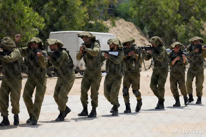 Member of Palestinian security forces display their skills during a military graduation ceremony in Gaza City June 2, 2016. Photo by Mohammed Asad