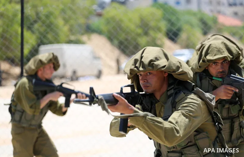 Member of Palestinian security forces display their skills during a military graduation ceremony in Gaza City June 2, 2016. Photo by Mohammed Asad