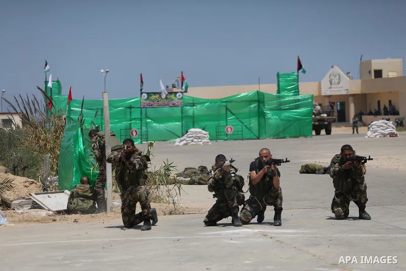 Member of Palestinian security forces display their skills during a military graduation ceremony in Gaza City June 2, 2016. Photo by Mohammed Asad