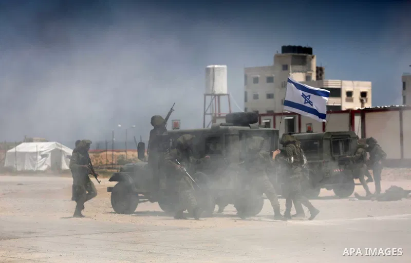 Member of Palestinian security forces display their skills during a military graduation ceremony in Gaza City June 2, 2016. Photo by Mohammed Asad