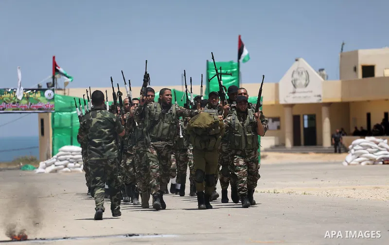 Member of Palestinian security forces display their skills during a military graduation ceremony in Gaza City June 2, 2016. Photo by Mohammed Asad
