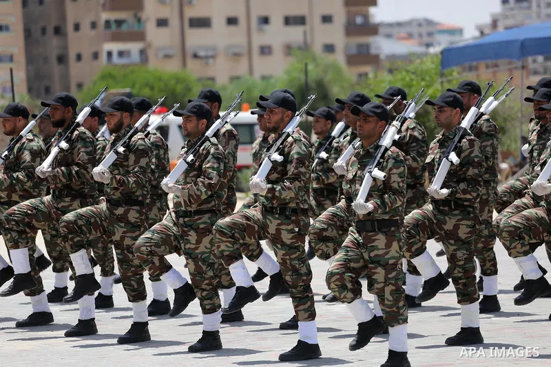 Member of Palestinian security forces display their skills during a military graduation ceremony in Gaza City June 2, 2016. Photo by Mohammed Asad
