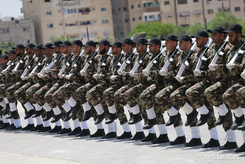 Member of Palestinian security forces display their skills during a military graduation ceremony in Gaza City June 2, 2016. Photo by Mohammed Asad