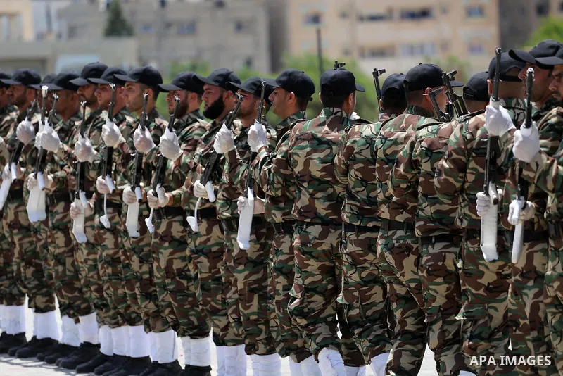 Member of Palestinian security forces display their skills during a military graduation ceremony in Gaza City June 2, 2016. Photo by Mohammed Asad