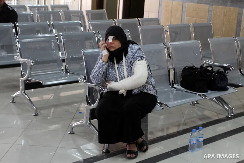 Palestinians wait for travel permits to cross into Egypt through the Rafah border crossing after it was opened for four days by Egyptian authorities, in the southern Gaza Strip June 02, 2016. Photo by Abed Rahim Khatib