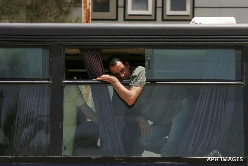 Palestinians wait for travel permits to cross into Egypt through the Rafah border crossing after it was opened for four days by Egyptian authorities, in the southern Gaza Strip June 02, 2016. Photo by Abed Rahim Khatib