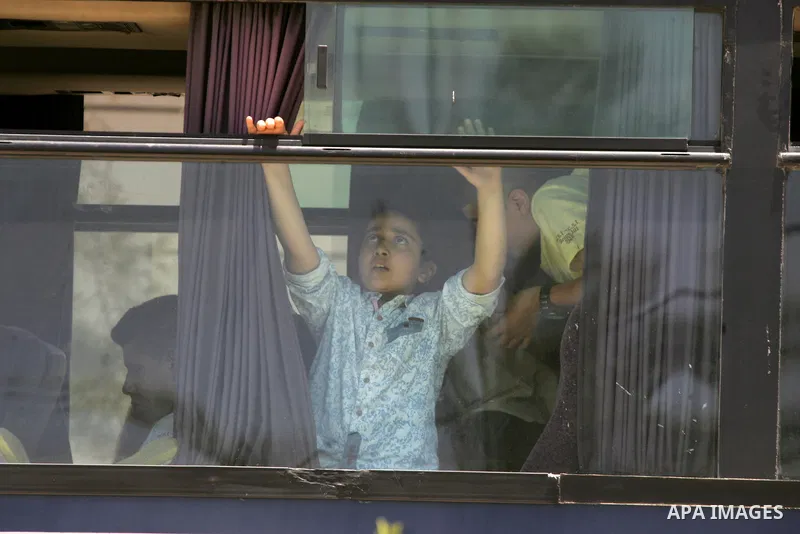 Palestinians wait for travel permits to cross into Egypt through the Rafah border crossing after it was opened for four days by Egyptian authorities, in the southern Gaza Strip June 02, 2016. Photo by Abed Rahim Khatib