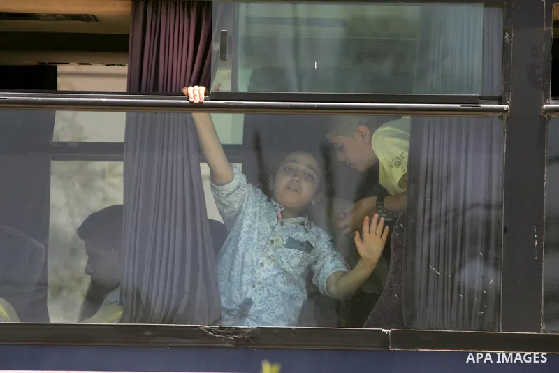 Palestinians wait for travel permits to cross into Egypt through the Rafah border crossing after it was opened for four days by Egyptian authorities, in the southern Gaza Strip June 02, 2016. Photo by Abed Rahim Khatib