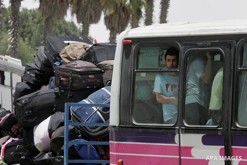 Palestinians wait for travel permits to cross into Egypt through the Rafah border crossing after it was opened for four days by Egyptian authorities, in the southern Gaza Strip June 02, 2016. Photo by Abed Rahim Khatib