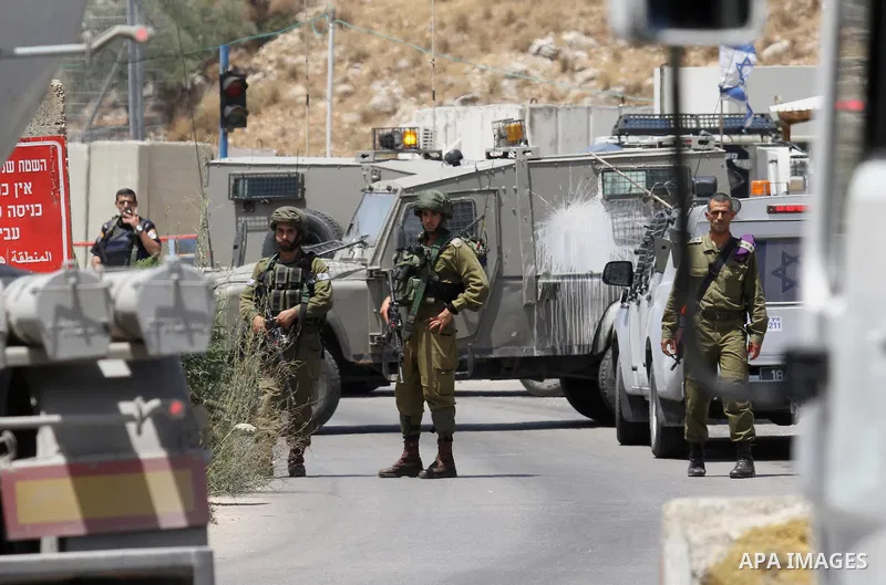 Israeli security forces inspect the scene of a stabbing attack at a checkpoint near the West Bank city of Tulkarem on June 2, 2016. A female Palestinian tried to stab an Israeli soldier near of Tulkarem and was shot dead...