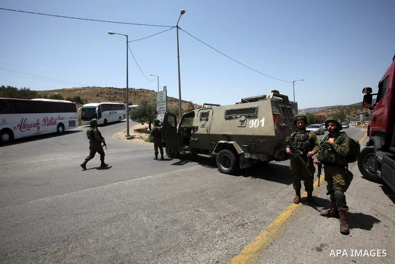 Israeli security forces inspect the scene of a stabbing attack at a checkpoint near the West Bank city of Tulkarem on June 2, 2016. A female Palestinian tried to stab an Israeli soldier near of Tulkarem and was shot dead...