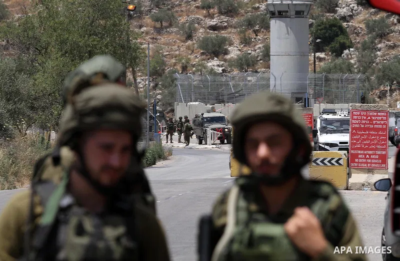Israeli security forces inspect the scene of a stabbing attack at a checkpoint near the West Bank city of Tulkarem on June 2, 2016. A female Palestinian tried to stab an Israeli soldier near of Tulkarem and was shot dead...