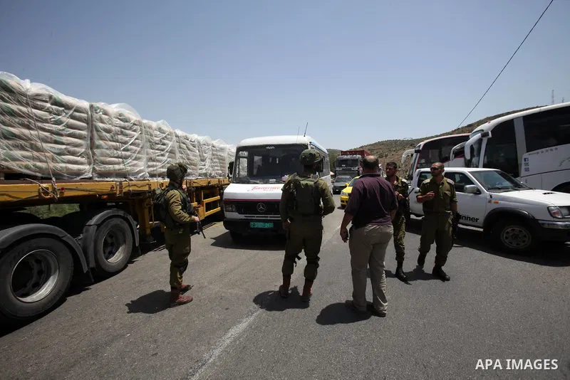 Israeli security forces inspect the scene of a stabbing attack at a checkpoint near the West Bank city of Tulkarem on June 2, 2016. A female Palestinian tried to stab an Israeli soldier near of Tulkarem and was shot dead...