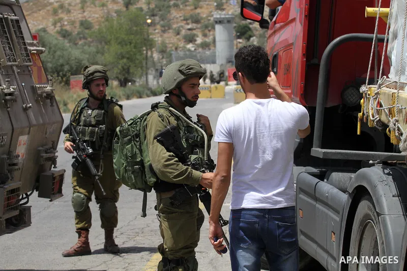Israeli security forces inspect the scene of a stabbing attack at a checkpoint near the West Bank city of Tulkarem on June 2, 2016. A female Palestinian tried to stab an Israeli soldier near of Tulkarem and was shot dead...