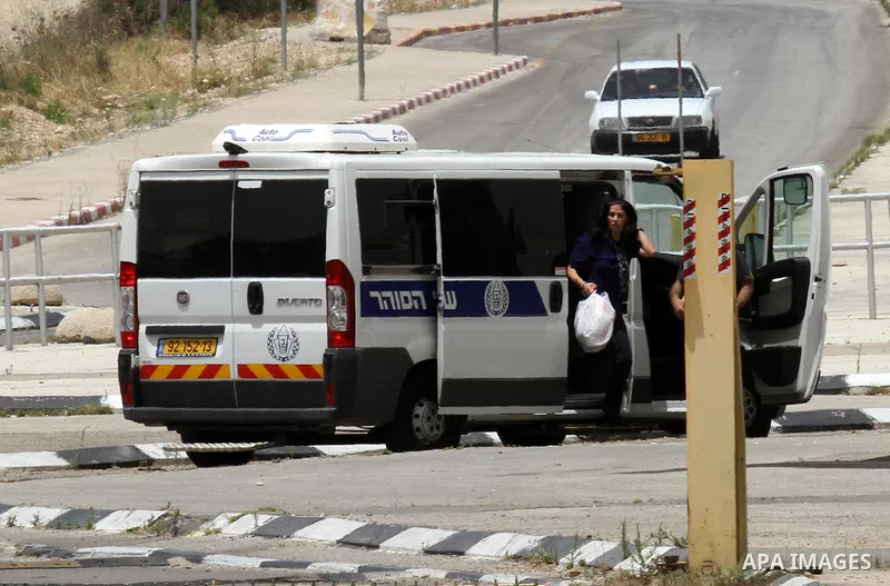 Prominent Palestinian lawmaker Khalida Jarrar walks through the Jubara checkpoint near the northern West Bank city of Tulkarem, following her release from an Israeli jail on June 3, 2016, after serving a 15-month sentenc...
