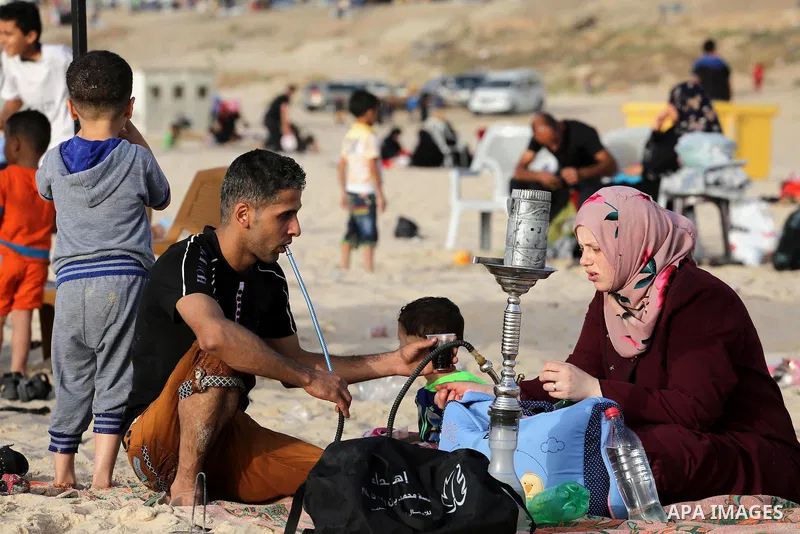 Palestinians enjoy a day at the beach of the Mediterranean sea on the coast of Gaza city, on June 03, 2016 on the last Friday before the Islamic holy month of Ramadan. Photo by Mohammed Asad