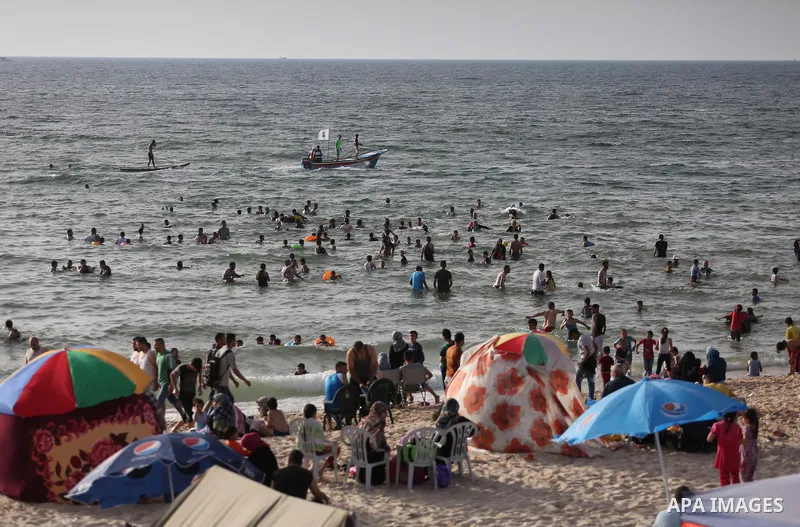 Palestininas swim in the Mediterranean sea on the coast of Gaza city, on June 03, 2016 on the last Friday before the Islamic holy month of Ramadan. Photo by Mohammed Asad