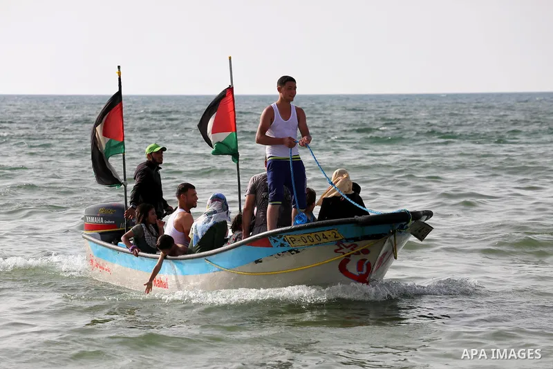 Palestininas swim in the Mediterranean sea on the coast of Gaza city, on June 03, 2016 on the last Friday before the Islamic holy month of Ramadan. Photo by Mohammed Asad