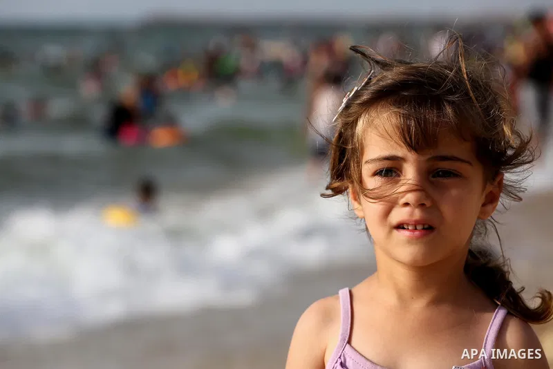 Palestinians enjoy a day at the beach of the Mediterranean sea on the coast of Gaza city, on June 03, 2016 on the last Friday before the Islamic holy month of Ramadan. Photo by Mohammed Asad