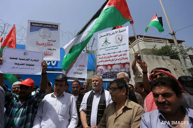 Palestinians take part in a protest to mark Naksa Day (setback), in front of the headquarter United Nation "UNSCO" in Gaza City, on June 04, 2016. Palestinians mark "Naksa Day" to mourn the 49th anniversary of Israel's o...