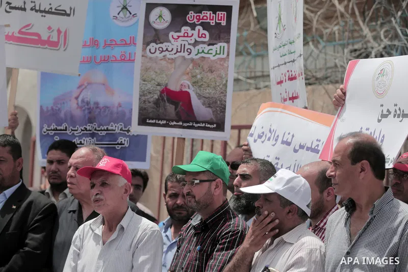 Palestinians take part in a protest to mark Naksa Day (setback), in front of the headquarter United Nation "UNSCO" in Gaza City, on June 04, 2016. Palestinians mark "Naksa Day" to mourn the 49th anniversary of Israel's o...