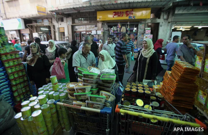 Palestinians shop at a traditional market in preparation for the holy month of Ramadan in the west bank city of Nablus on June 4,2016. Muslims around the world refrain from eating, drinking and sexual intercourse from da...