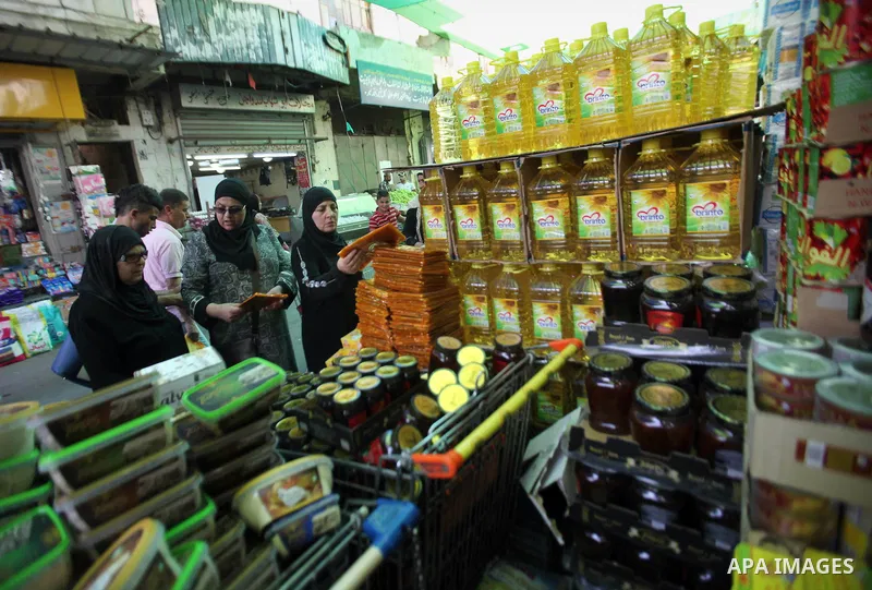 Palestinians shop at a traditional market in preparation for the holy month of Ramadan in the west bank city of Nablus on June 4,2016. Muslims around the world refrain from eating, drinking and sexual intercourse from da...