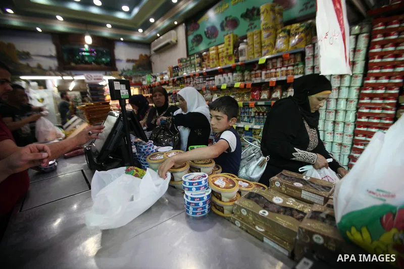 Palestinians shop at a traditional market in preparation for the holy month of Ramadan in the west bank city of Nablus on June 4,2016. Muslims around the world refrain from eating, drinking and sexual intercourse from da...