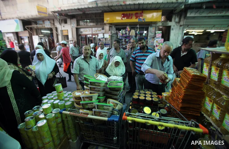 Palestinians shop at a traditional market in preparation for the holy month of Ramadan in the west bank city of Nablus on June 4,2016. Muslims around the world refrain from eating, drinking and sexual intercourse from da...