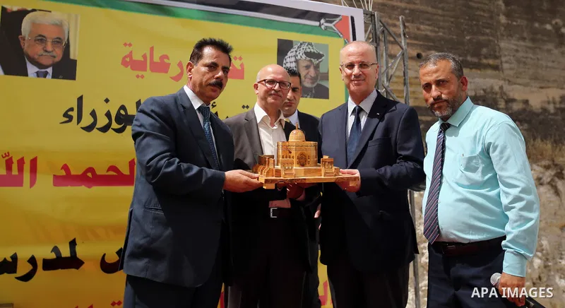 Palestinian Prime Minister Rami Hamdallah puts the corner stone for the Martyrs of the High school for Girls in the West Bank city of Nablus on June 4.2016 Photo by Prime Minister Office