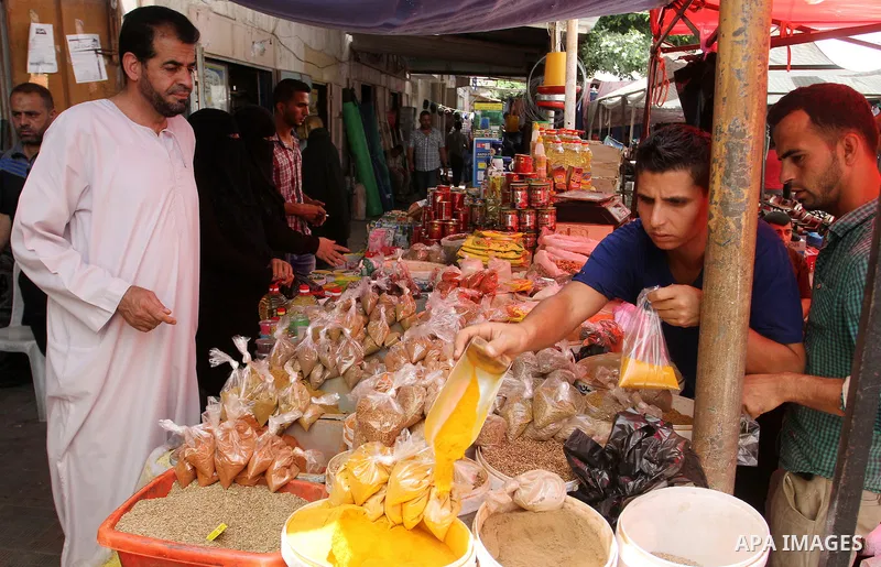 Palestinians shop at a traditional market in preparation for the holy month of Ramadan in Rafah in the southern Gaza strip on June 4,2016. Muslims around the world refrain from eating, drinking and sexual intercourse fro...